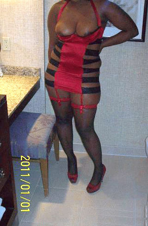 Mature ebony beauty in black stockings,