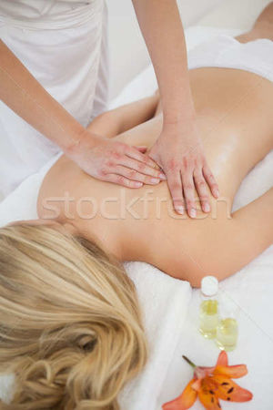Blonde enjoying a back massage stock