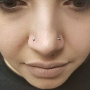 Double nostril piercings by Nikey -